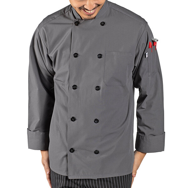 A man wearing a Uncommon Chef slate gray long sleeve chef coat.