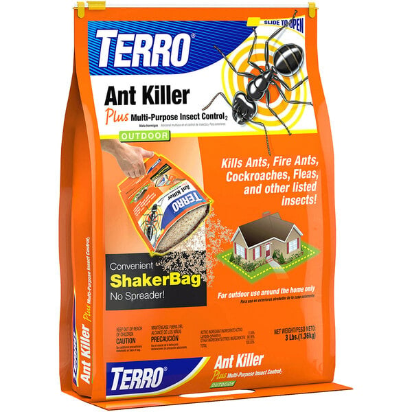 A hand holding a package of Terro ant killer food.