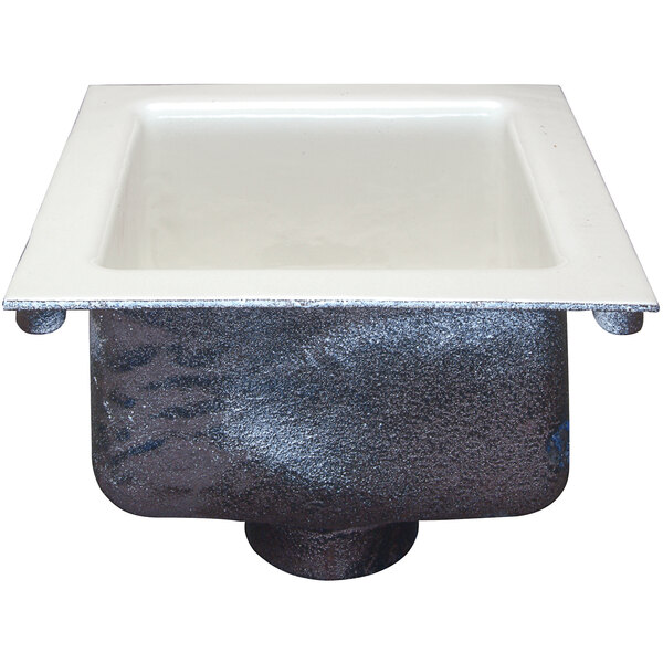 A Zurn white cast iron floor sink with a square bottom.