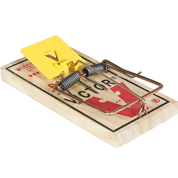 A Victor Pest rat trap with a yellow and red handle.