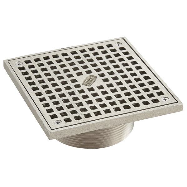 A Zurn polished nickel bronze square metal strainer with square openings.