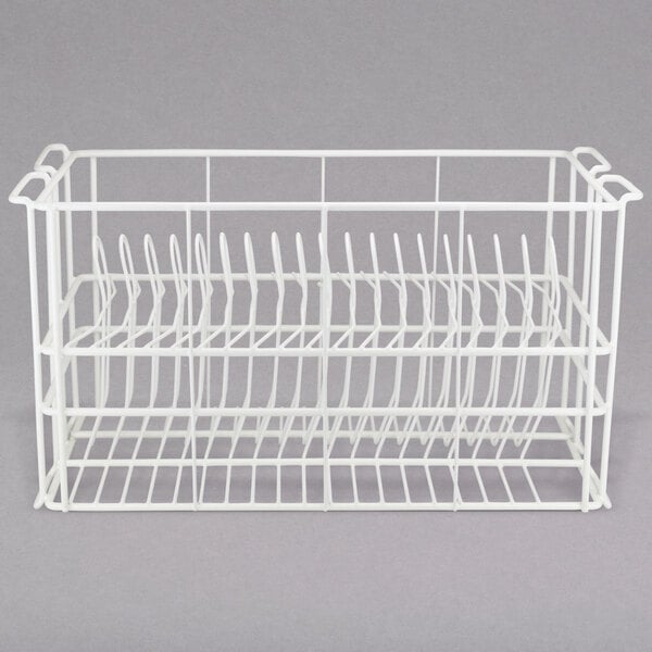 A white wire rack with compartments for dinner plates.