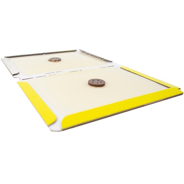A yellow and white Victor Pest mouse glue board package.