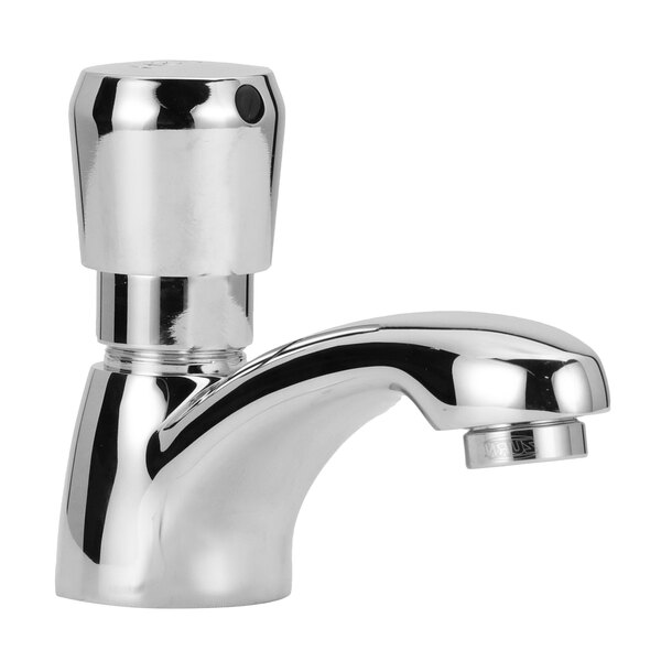 A Zurn chrome deck mount metering faucet with a single handle.