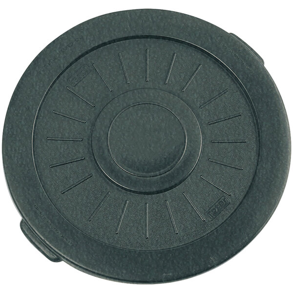 A Toter greenstone plastic lid with a circular pattern.