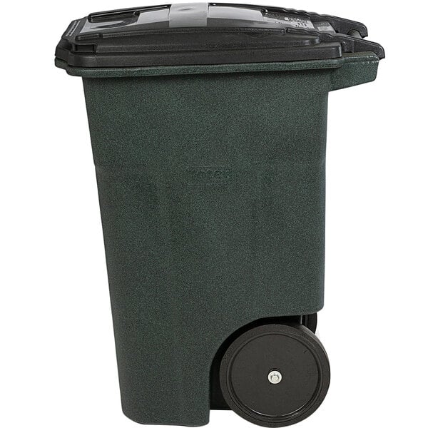 A green Toter rectangular trash can with wheels and a lid.
