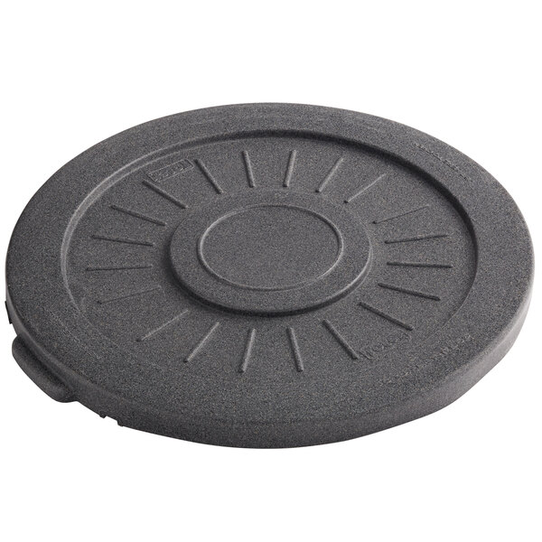A grey circular lid with lines on it.