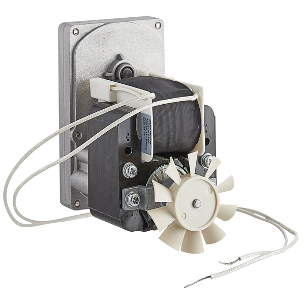 A close-up of a small electric motor with a white fan.