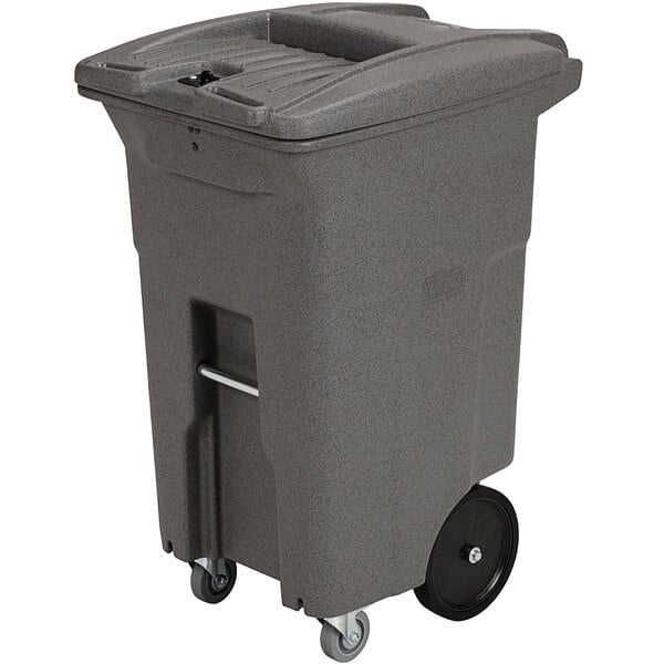 A grey trash can with wheels.