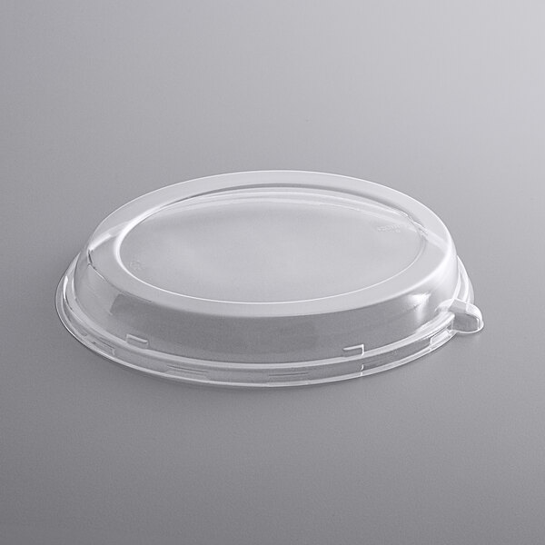 A clear plastic Fineline PETE lid on a white plastic container.