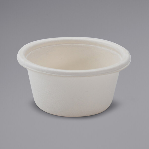 A white bagasse portion cup with a lid.