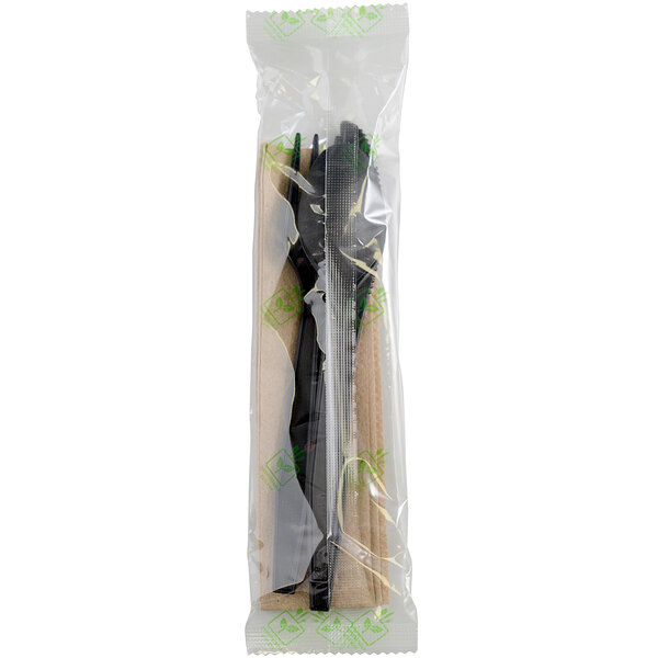 A plastic bag with two black wrapped Fineline plastic utensils and a napkin.