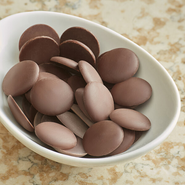 A bowl of Guittard Coucher du Soleil chocolate wafers.