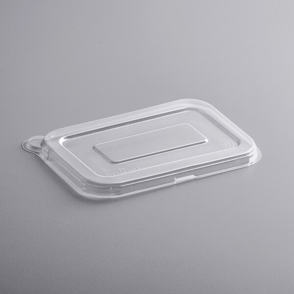 A clear plastic Fineline rectangular lid on a clear plastic container.