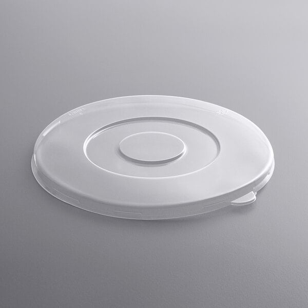 A white plastic Fineline lid with a circular design.