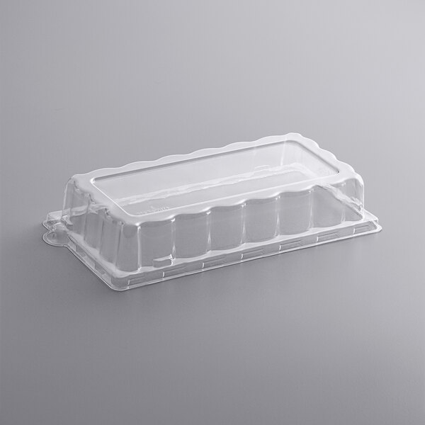 A clear Fineline PETE dome lid on a clear plastic container.