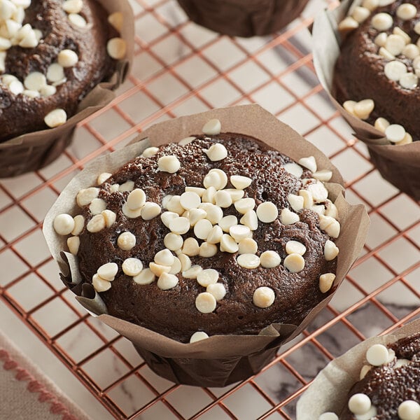 A chocolate muffin with Guittard white chocolate chips on top.