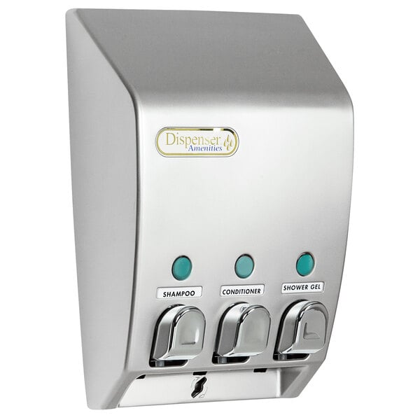 A satin silver wall mounted amenity dispenser with three chambers and buttons.