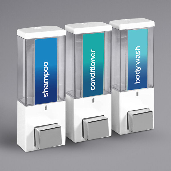 A white wall-mounted Dispenser Amenities iQon shower dispenser with three translucent bottles.