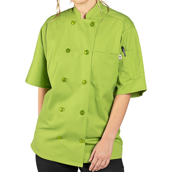 A person wearing a green Uncommon Chef South Beach avocado print chef coat.