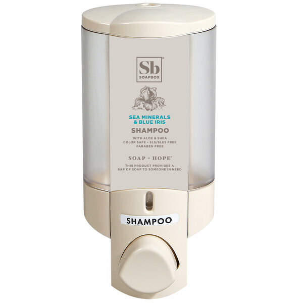 A white wall-mounted soap dispenser with a translucent plastic bottle and a label with the word "Soapbox"
