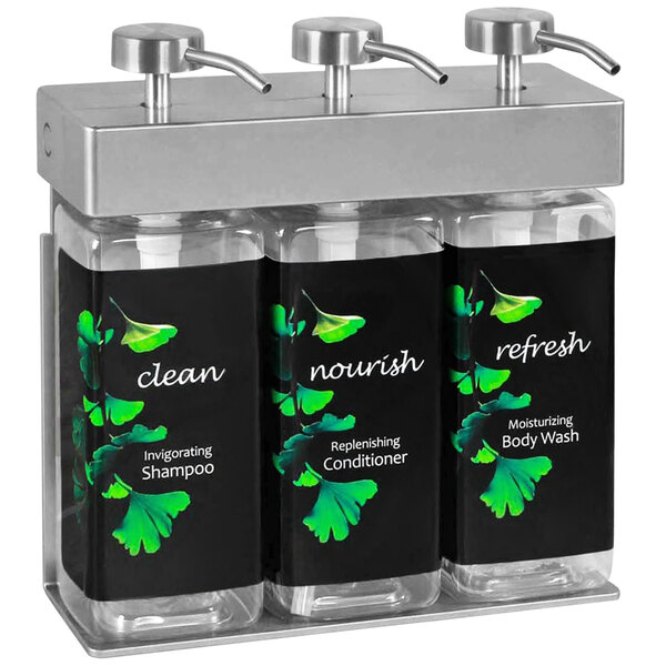 A Dispenser Amenities wall-mounted shower dispenser with three rectangular bottles of Ginkgo-labeled hand soap.