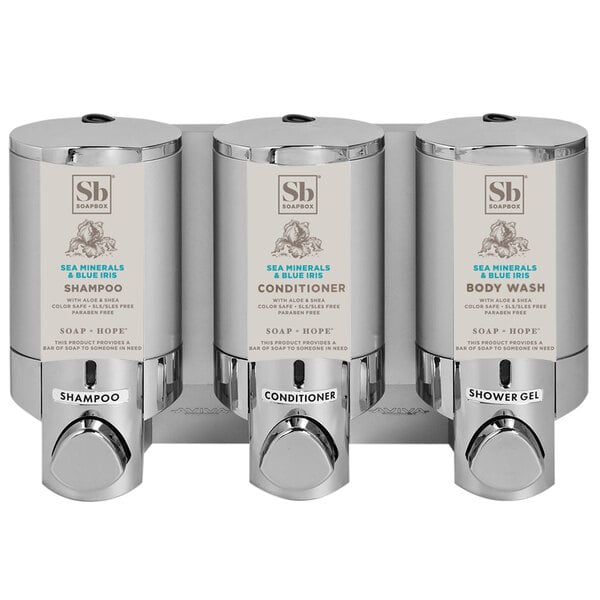 Three chrome Dispenser Amenities Aviva wall-mounted soap dispensers with satin silver labels.
