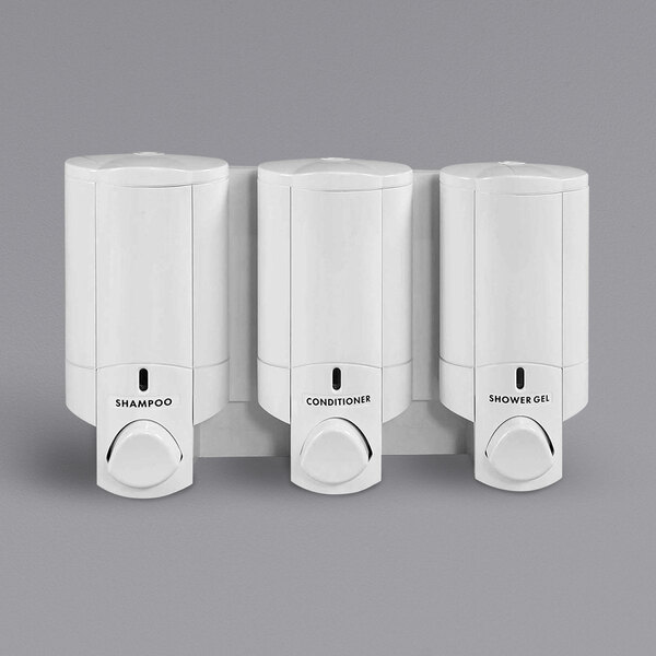 Three white Dispenser Amenities Aviva 3-chamber wall mounted dispensers.