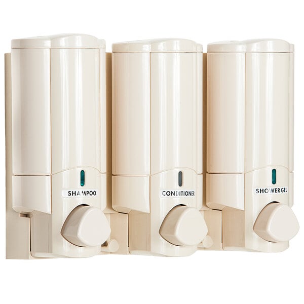 A white rectangular wall-mounted dispenser with three round containers inside.