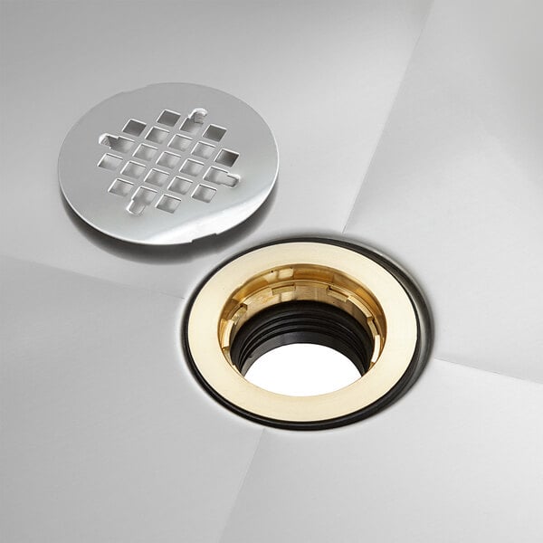 A Regency mop sink drain assembly with silver and gold finishes.