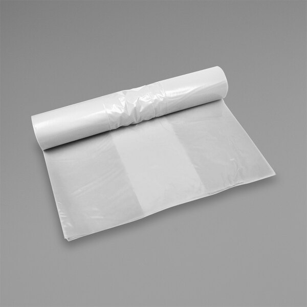 A white roll of LK Packaging clear plastic equipment covers.