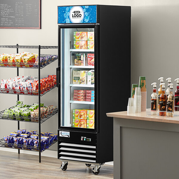An Avantco glass door merchandiser freezer with a variety of food on shelves.