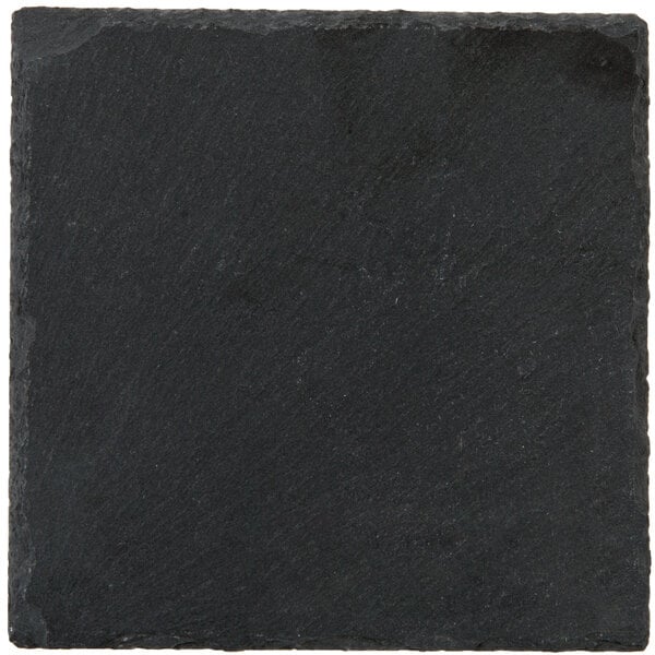 An Acopa black slate square coaster with soapstone chalk on a white background.