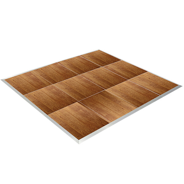 A Palmer Snyder American Plank vinyl portable dance floor with silver trim on white wood panels.