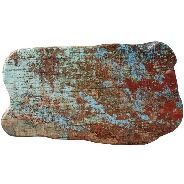 An American Metalcraft faux reclaimed wood melamine serving board on a table with red and blue wood.