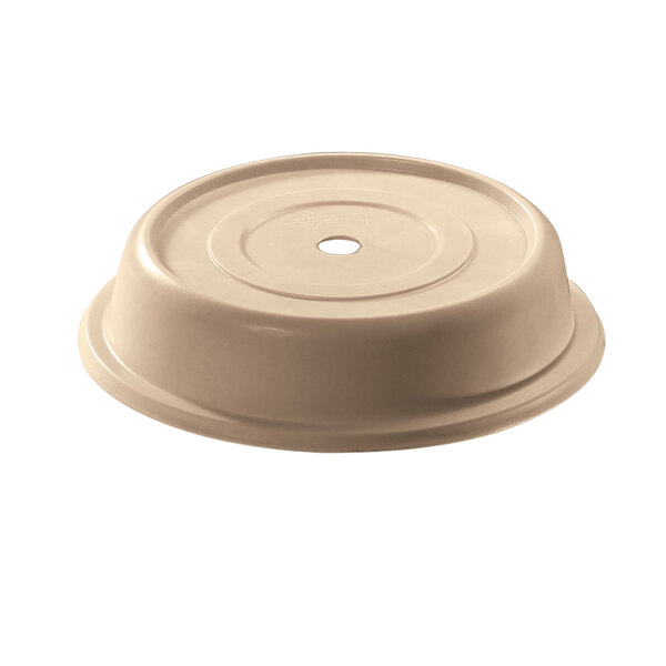 A beige plastic Cambro plate cover with a hole.