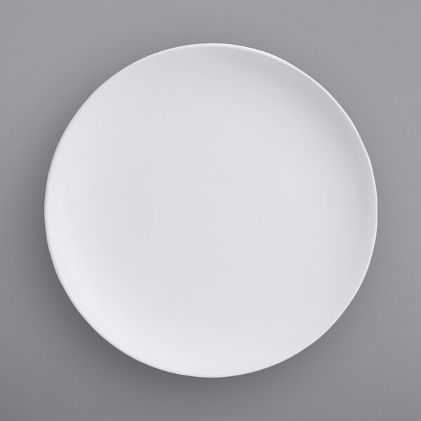 An American Metalcraft matte white melamine plate on a gray surface.