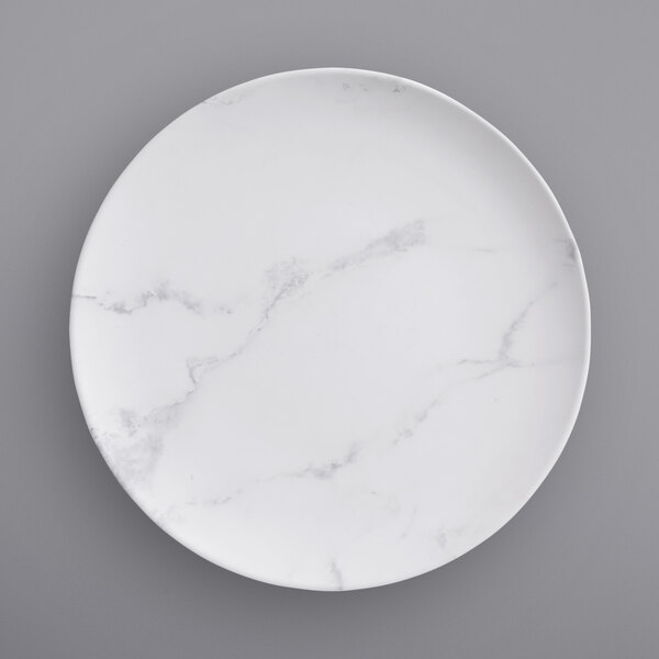 An American Metalcraft Mix & Matte white melamine plate with a marble pattern.