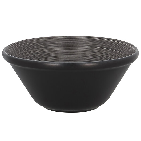 A stackable black bowl with a grey stripe design on a table.