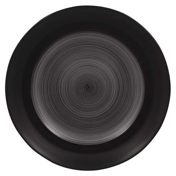 A black RAK Porcelain plate with a circular pattern.