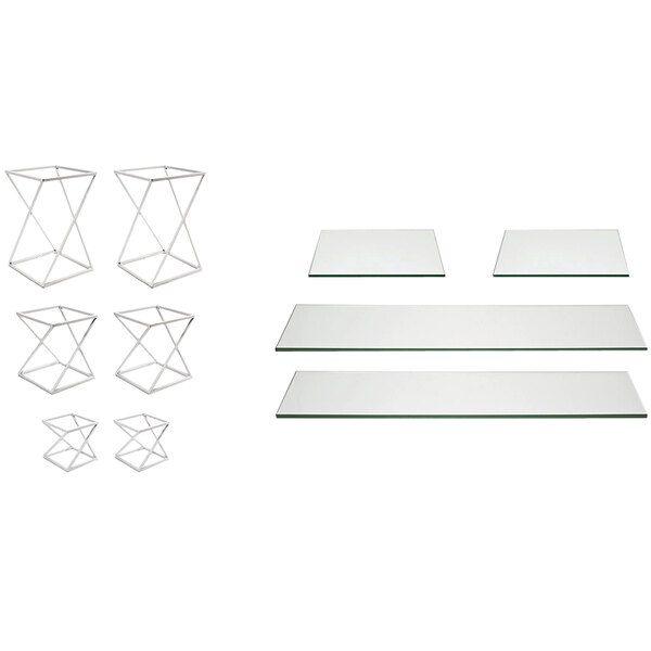 A white metal riser set with glass shelves on a white table.