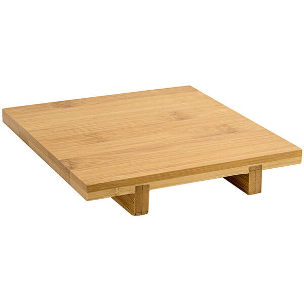 A natural bamboo square footed serving tray.
