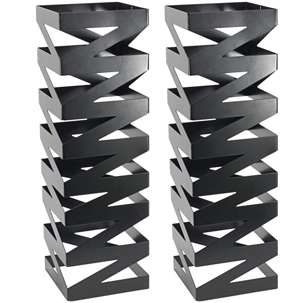 Two matte black stainless steel square risers with a zigzag design.