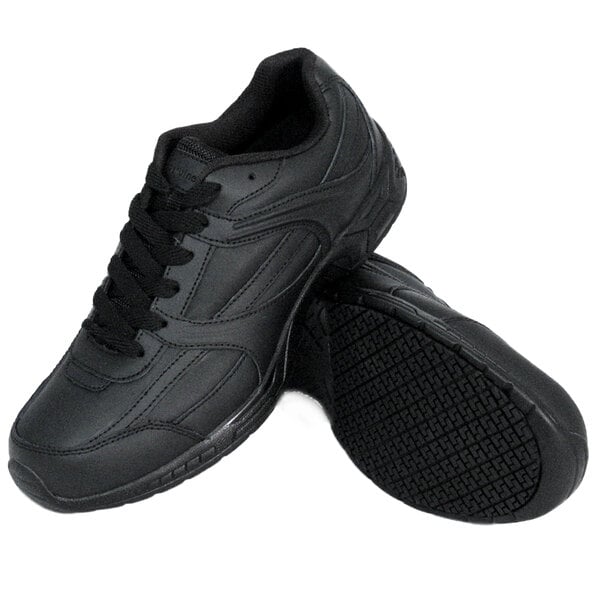 A pair of Genuine Grip black leather athletic shoes with laces.