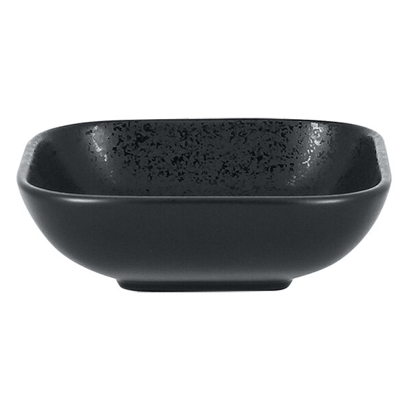 A black square porcelain bowl with a speckled surface and small black specks.