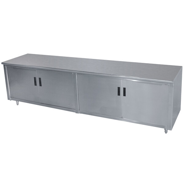 A long stainless steel cabinet with three hinged doors.