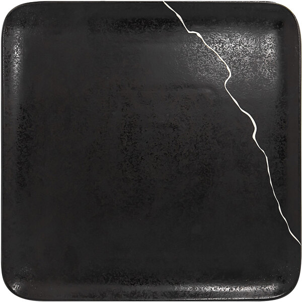 A black square RAK Porcelain Kintzoo porcelain plate with a crack in the middle.