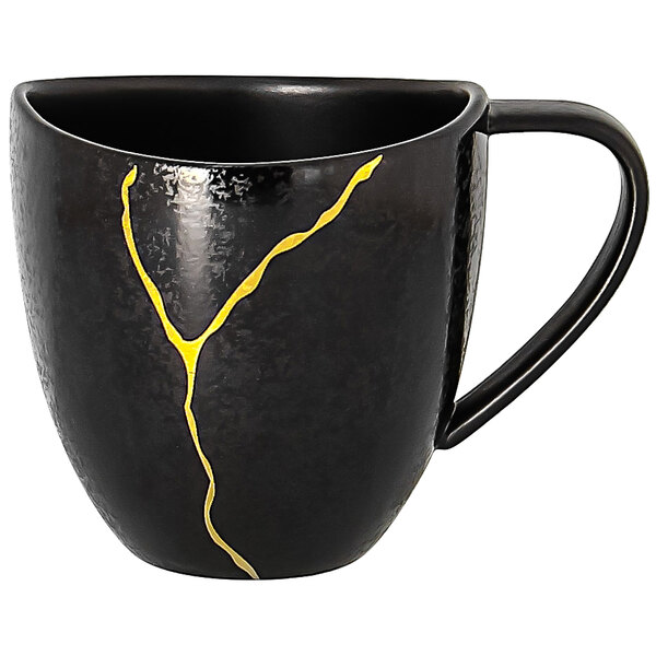 A black RAK Porcelain Kintzoo cup with gold detail on the side.