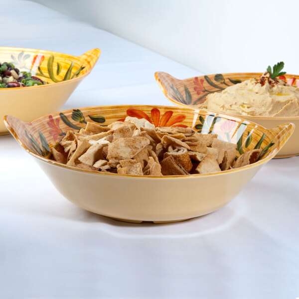 Three GET Venetian bowls filled with food on a table.