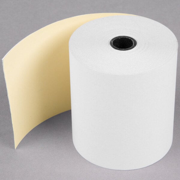 A roll of white Point Plus carbonless paper with a yellow edge.